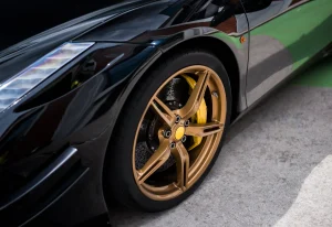 black-sedan-car-wheel-with-golden-bronze-color-decoration