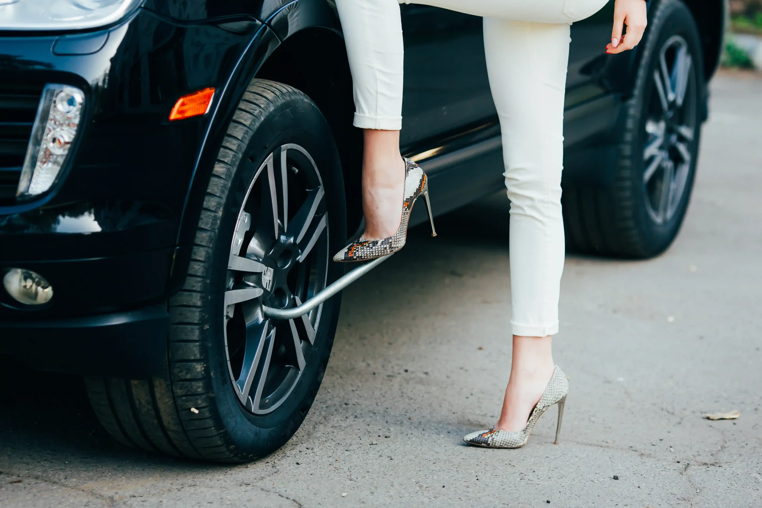 cheerful-young-woman-with-luxury-car
